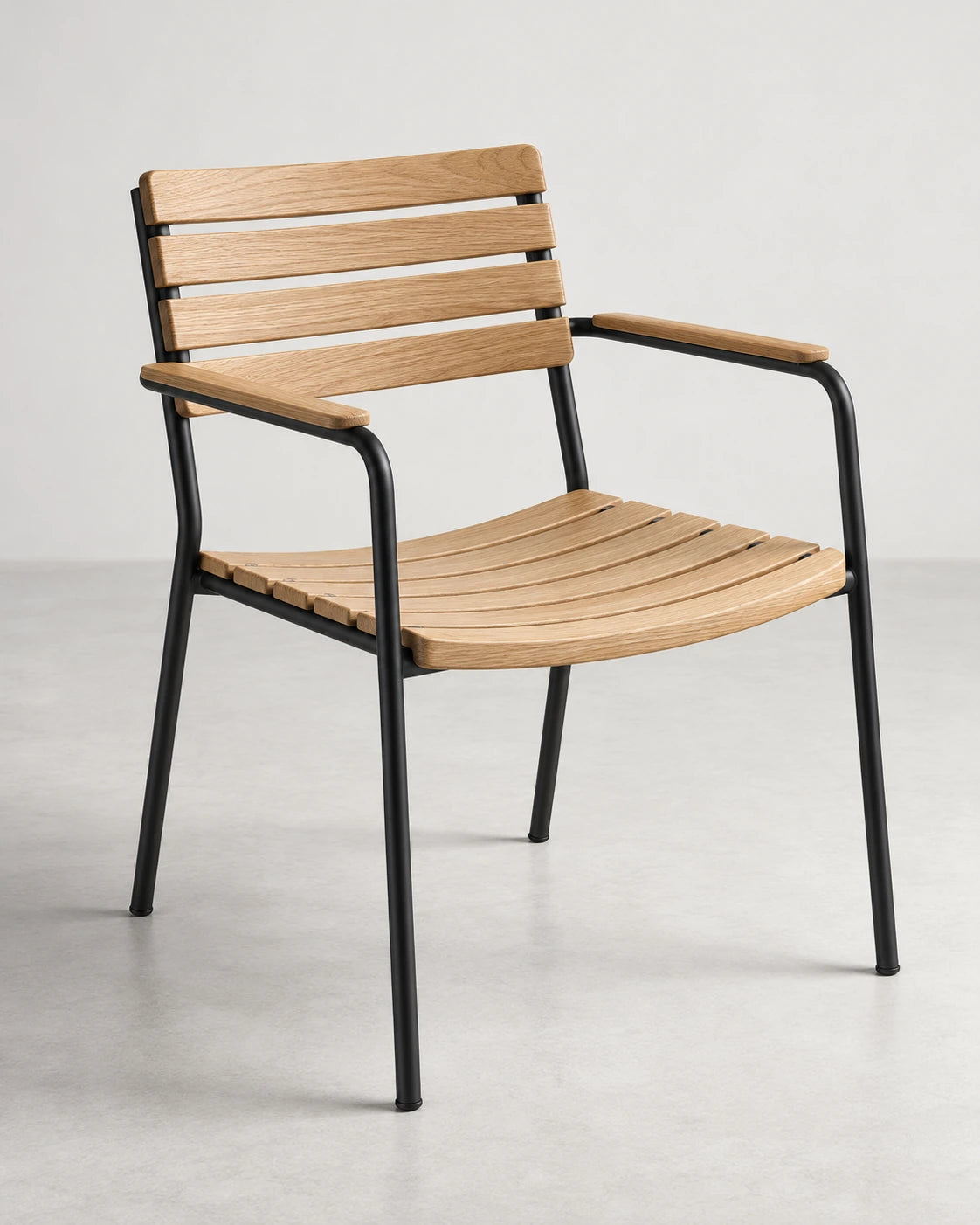 Oak slatted chair with a slim black frame, shown in full on a light studio floor.